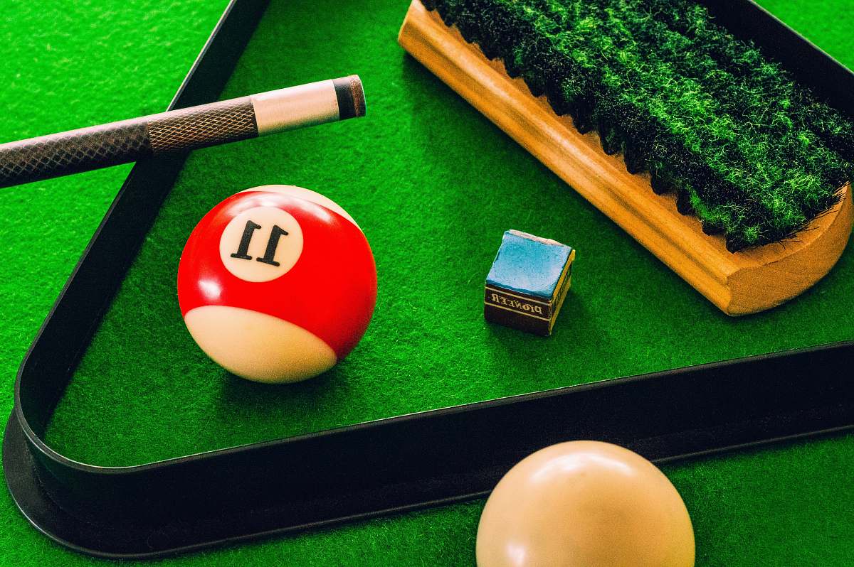 new zealand 11 cue ball on green surface billiard